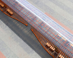 nudes' flow pavilion forms sinuous steel-pipe bridge between two exhibition halls in india