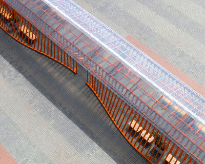 nudes' flow pavilion forms sinuous steel-pipe bridge between two exhibition halls in india