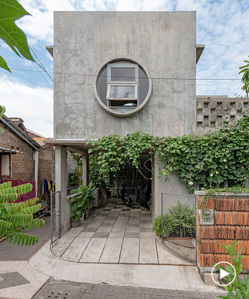 urban concrete home in indonesia blooms among four green gardens