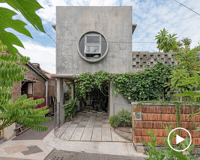 urban concrete home in indonesia blooms among four green gardens