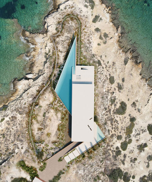 summer residence's sharp geometry emerges from greek seaside slope