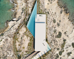 summer residence's sharp geometry emerges from greek seaside slope