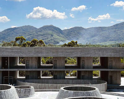 rainwater cascades in thin curtains within synchronicity's 'rain house' in hainan