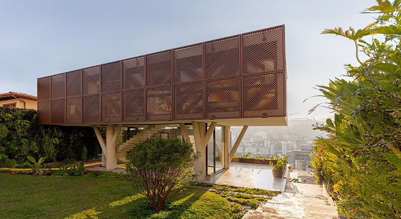 TETRO elevates house on concrete tree-like columns above the hills of belo horizonte, brazil
