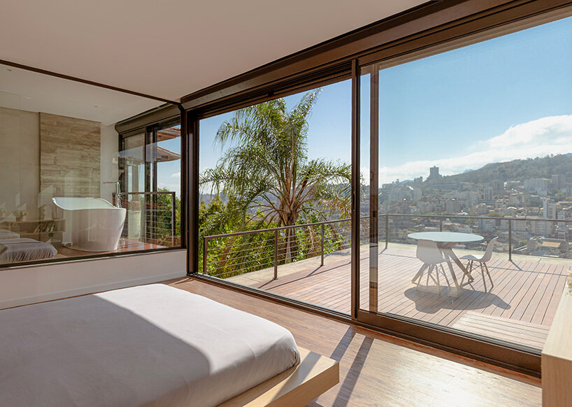 TETRO elevates house on concrete tree-like columns above the hills of belo horizonte, brazil