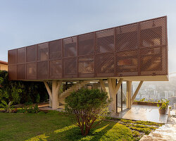 TETRO elevates house on concrete tree-like columns above the hills of belo horizonte, brazil