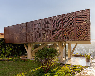 TETRO elevates house on concrete tree-like columns above the hills of belo horizonte, brazil