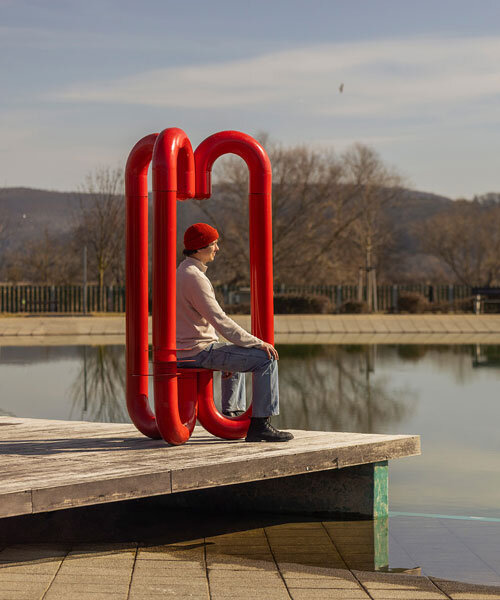 three-legged installation turns industrial gas pipes into intimate public shelter