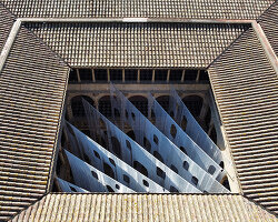 translucent organza curtains float within renaissance arched courtyard in spain