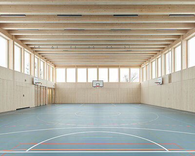 vertical timber construction shapes twin stacked sports halls in switzerland by kit