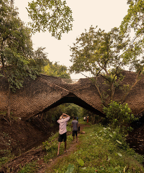 wallmakers wraps its suspended 'bridge house' in skin of thatched scales