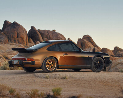 black to gold: refinished 1984 porsche 911 glimmers in the california desert