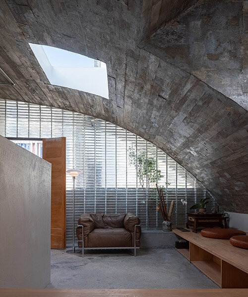 concrete arches enclose glass block interiors of renovated xuebei home in guangdong