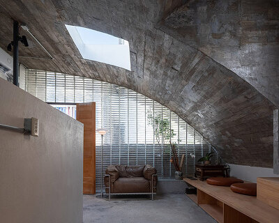 concrete arches enclose glass block interiors of renovated xuebei home in guangdong
