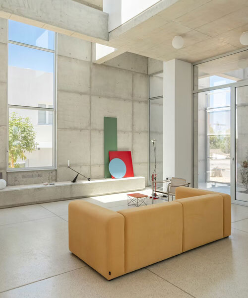 vertical cuts split monolithic 'cube within a cube' suburban residence in cyprus