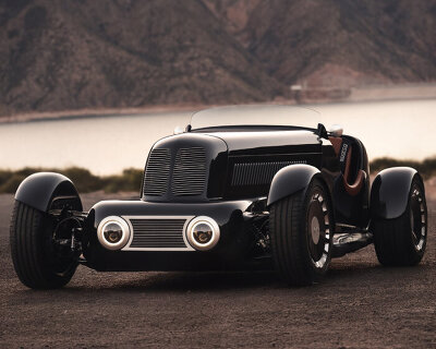 art deco-inspired restomod car drives around in handcrafted vintage bodywork