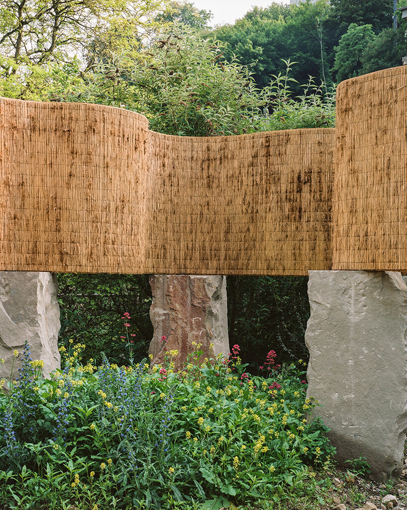 atelier faber stacks reeds over luxembourg sandstone to revive soil porosity on old well site