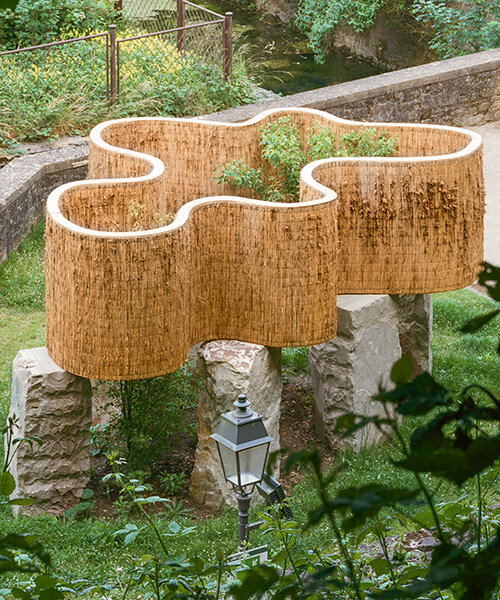 atelier faber stacks reeds over luxembourg sandstone to revive soil porosity on old well site