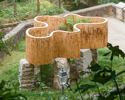 atelier faber stacks reeds over luxembourg sandstone to revive soil porosity on old well site
