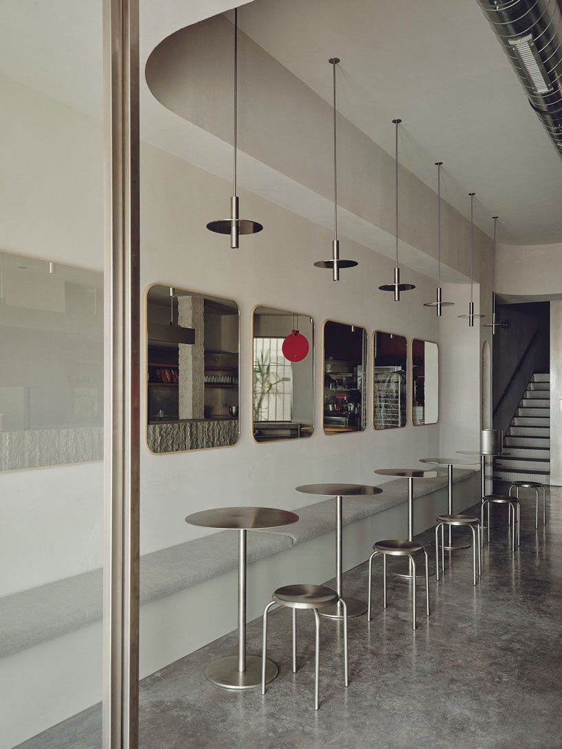 café's curved interiors by zooco estudio reflect art deco siboney building in spain