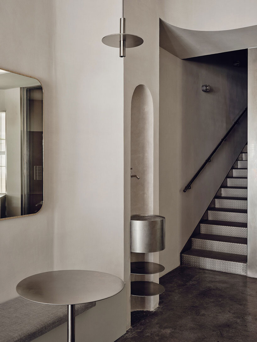 café's curved interiors by zooco estudio reflect art deco siboney building in spain