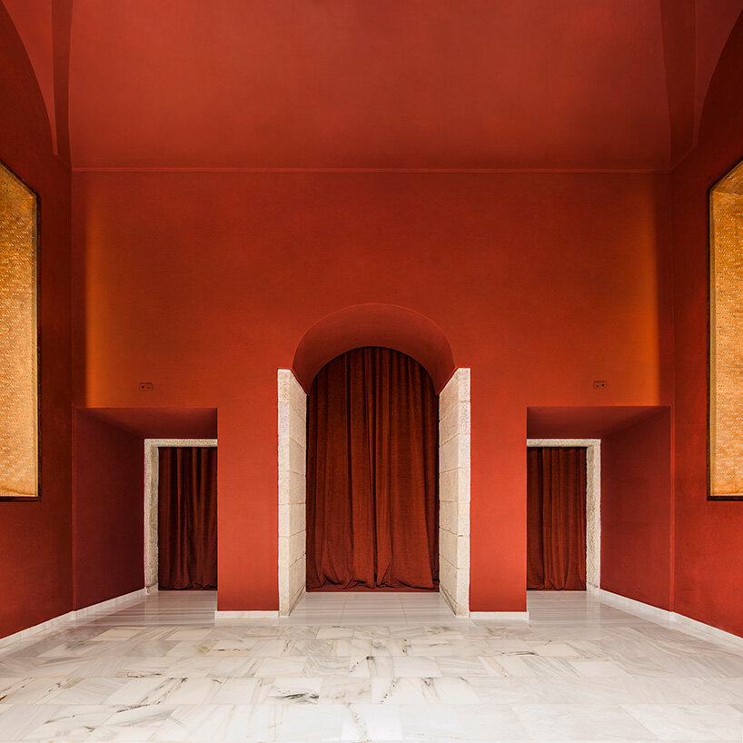 BACH converts reina sofía's auditorium into red-velvet cinema beneath blue vault in madrid