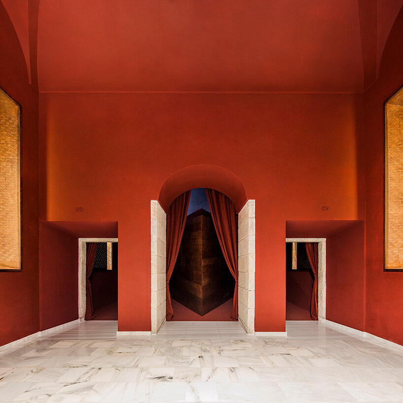 BACH converts reina sofía's auditorium into red-velvet cinema beneath blue vault in madrid