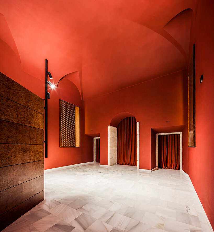 BACH converts reina sofía's auditorium into red-velvet cinema beneath blue vault in madrid