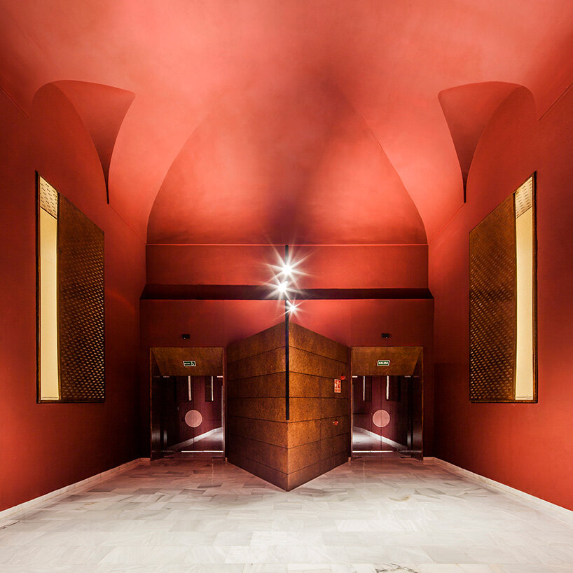 BACH converts reina sofía's auditorium into red-velvet cinema beneath blue vault in madrid