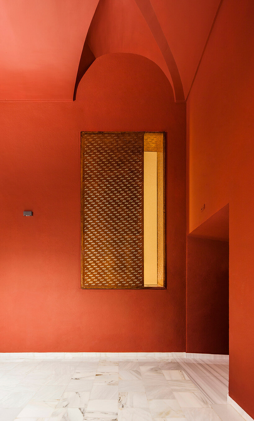 BACH converts reina sofía's auditorium into red-velvet cinema beneath blue vault in madrid