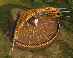 interwoven bamboo poles fan outward to form theater stage by cheng tsung feng