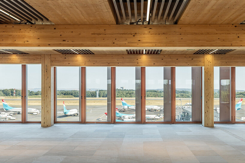 BIG's timber 'snakes' rise as skypark business center nears completion in luxembourg