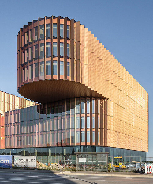 BIG's timber 'snakes' rise as skypark business center nears completion in luxembourg