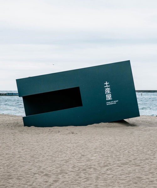 buried souvenir shop on japanese shoreline reflects on tourism, land, and memory