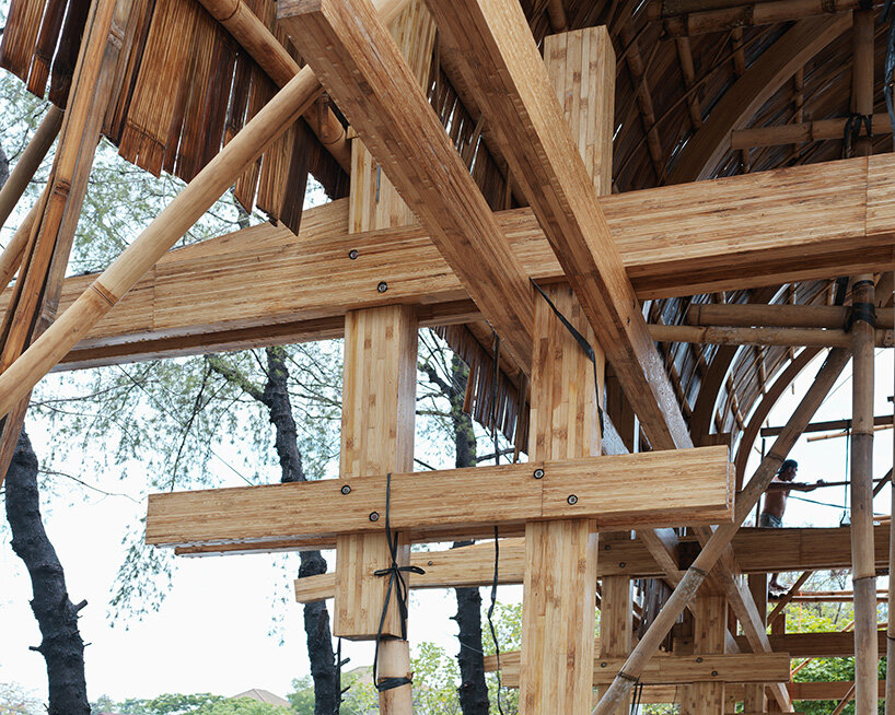 carbon-negative bamboo pavilion by cave urban gives new life to disused car park in bali