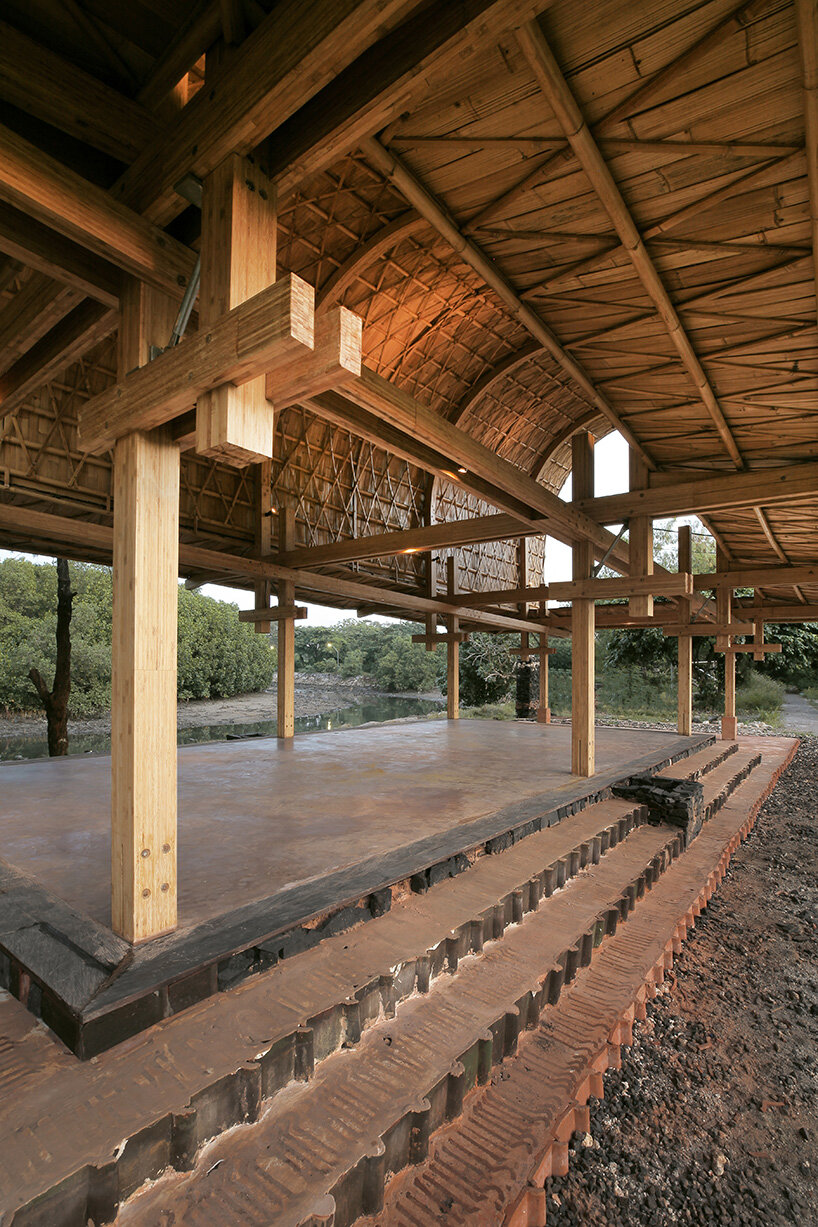 carbon-negative bamboo pavilion by cave urban gives new life to disused car park in bali