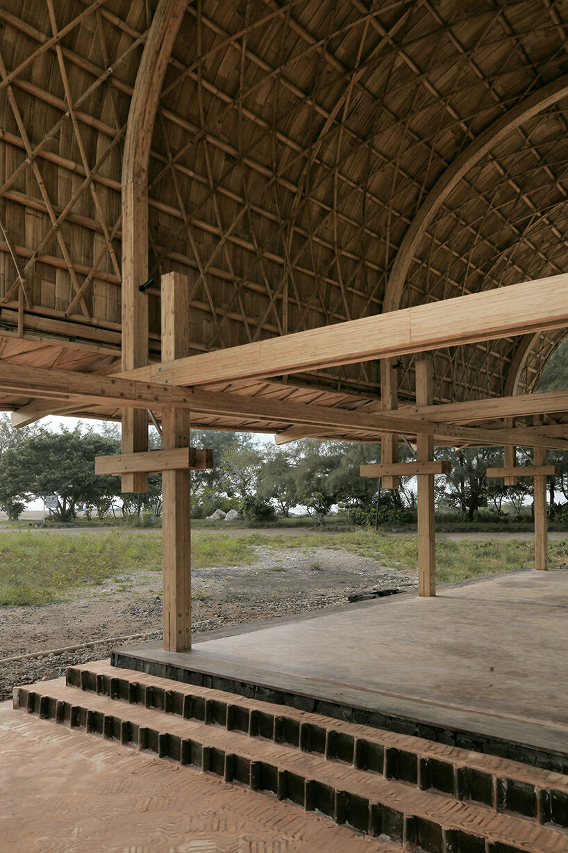 carbon-negative bamboo pavilion by cave urban gives new life to disused car park in bali