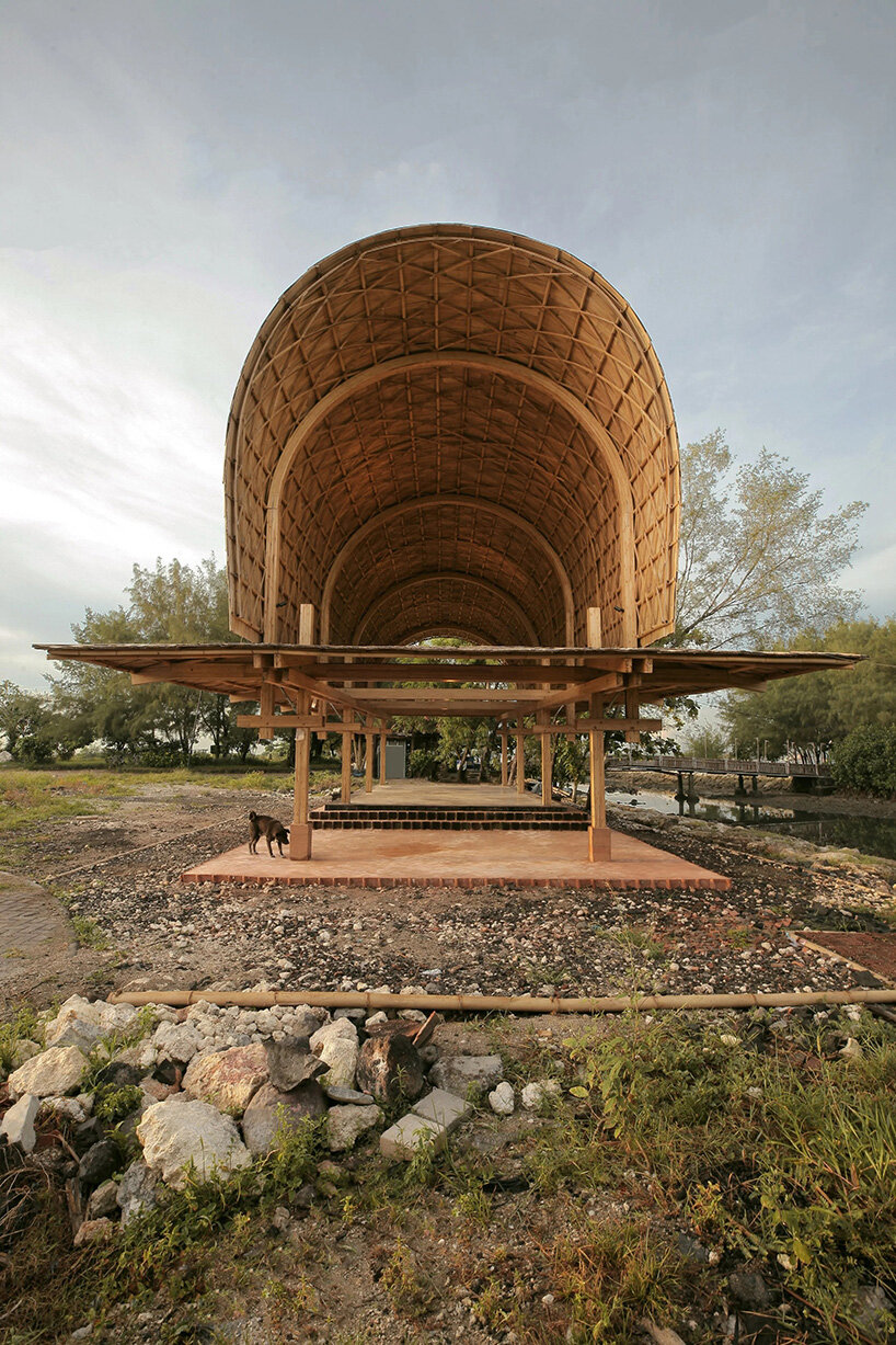 carbon-negative bamboo pavilion by cave urban gives new life to disused car park in bali