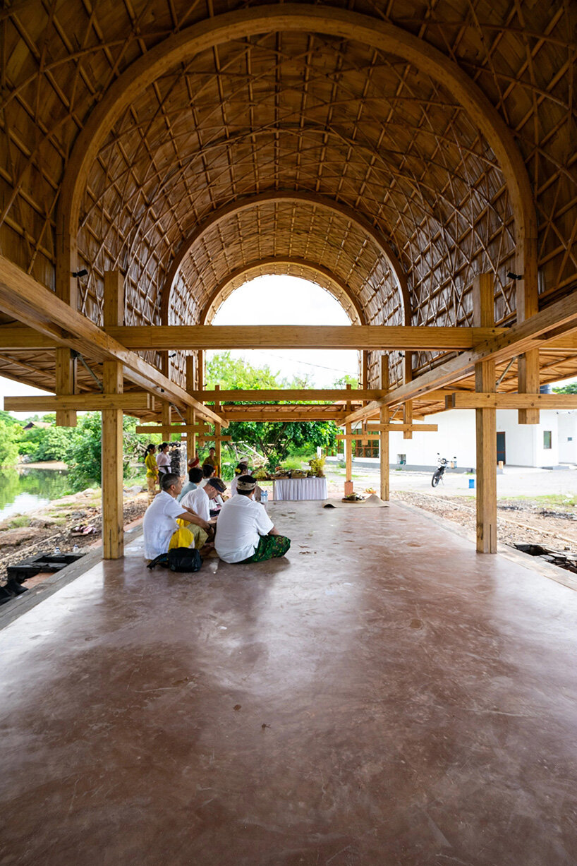 carbon-negative bamboo pavilion by cave urban gives new life to disused car park in bali