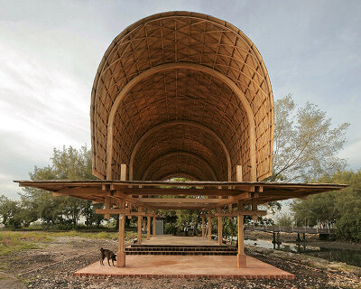 carbon-negative bamboo pavilion by cave urban gives new life to disused car park in bali