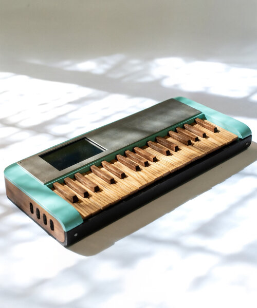 cardboard synthesizer plays sounds using handmade wooden keys cut from walnut and oak