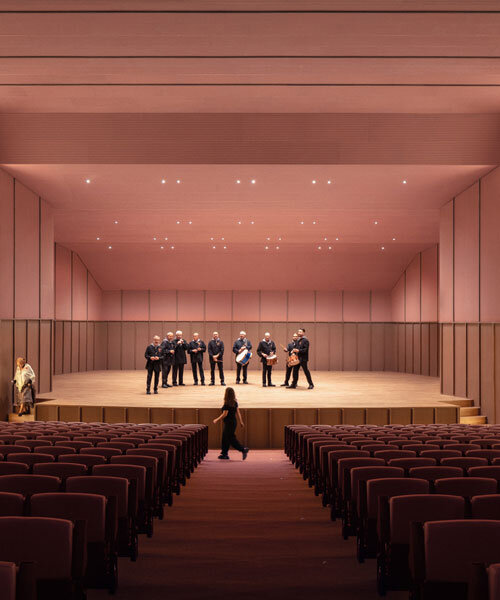 bright pink interior revitalizes adaptive acoustic music hall for sax’s cultural complex in spain