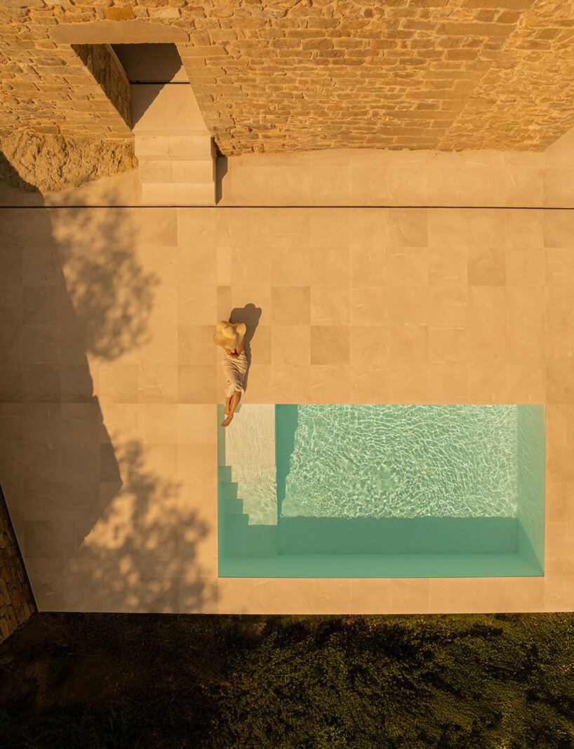 fran silvestre restores limestone farmhouse in spain as off-grid home and workspace