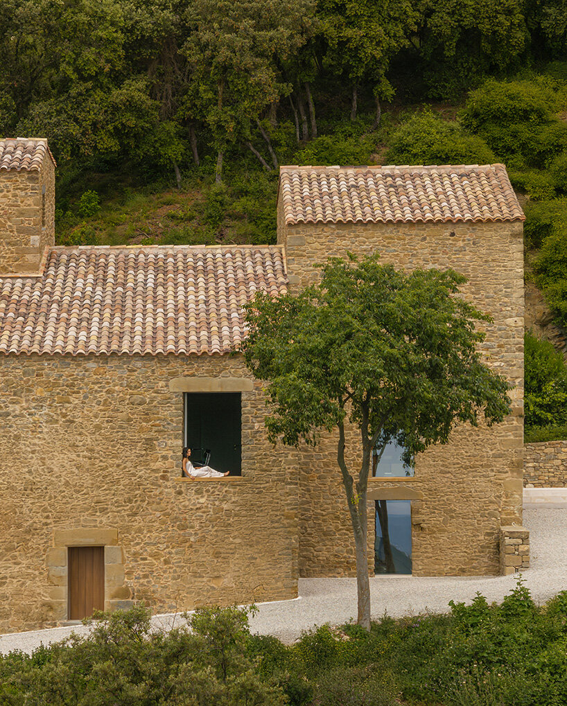 fran silvestre restores limestone farmhouse in spain as off-grid home and workspace