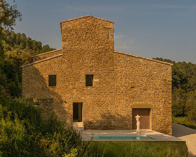 fran silvestre restores limestone farmhouse in spain as off-grid home and workspace