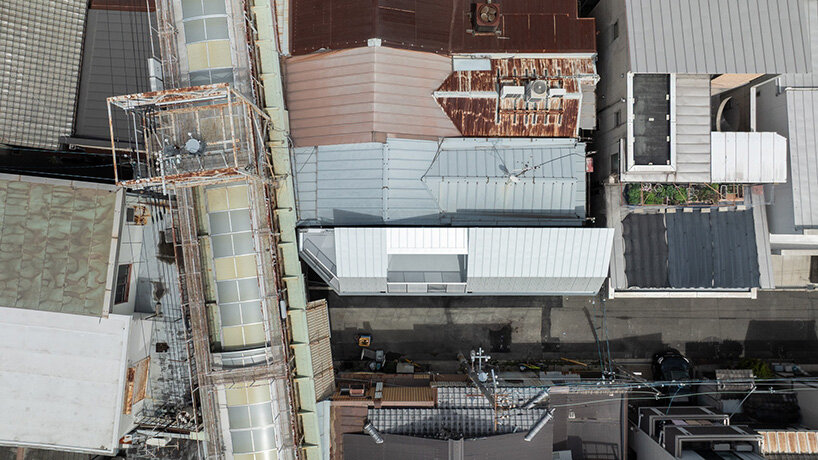 grid of operable windows fronts slender residence by okuwada architects in osaka