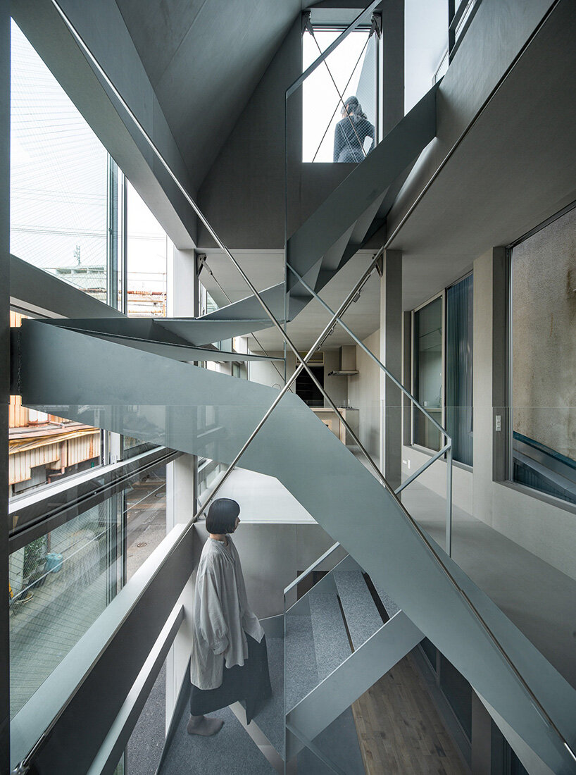 grid of operable windows fronts slender residence by okuwada architects in osaka