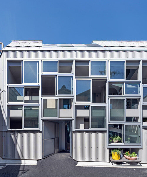 grid of operable windows fronts slender residence by okuwada architects in osaka
