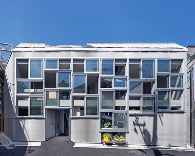 grid of operable windows fronts slender residence by okuwada architects in osaka