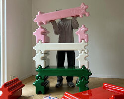 gustaf westman's stackable storage snaps together like giant glossy jigsaw pieces